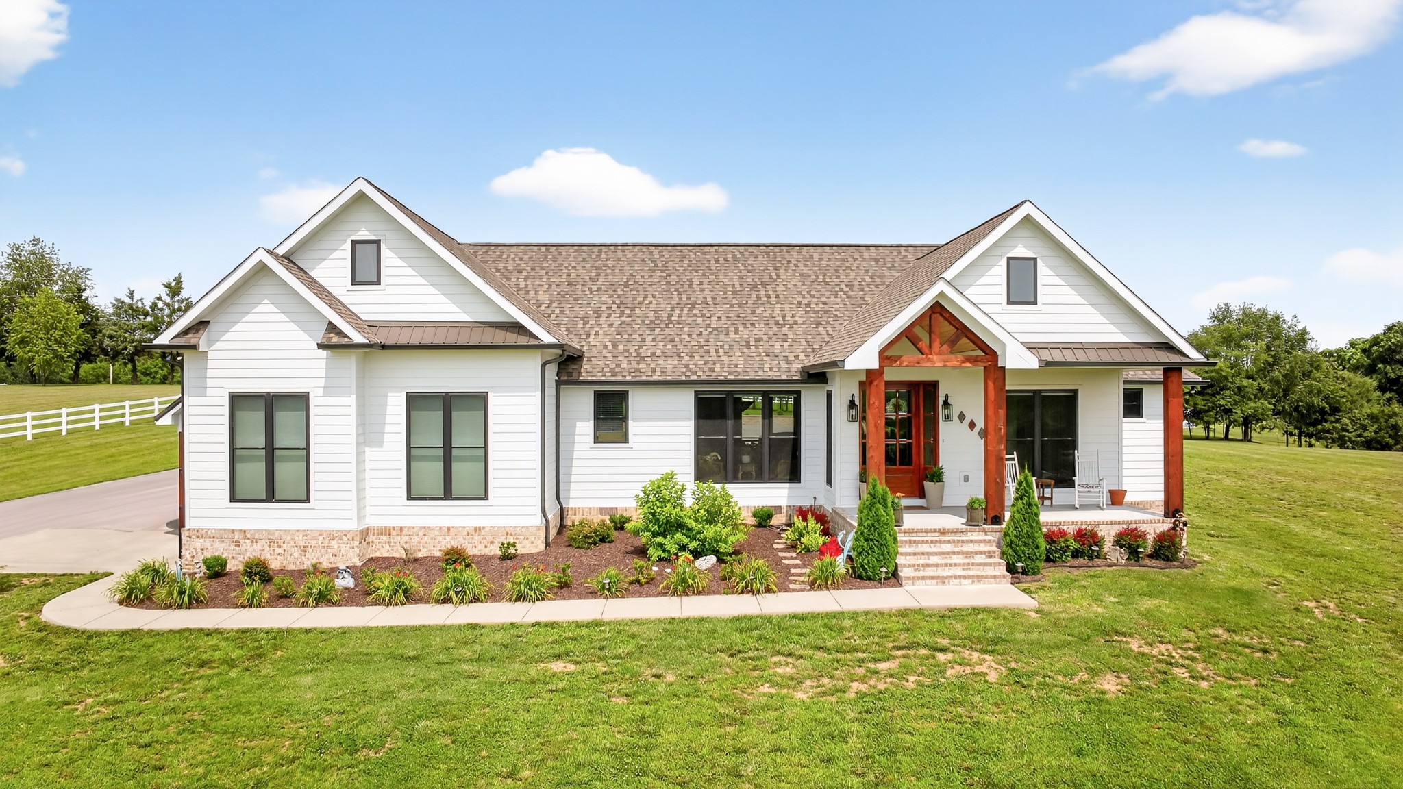 7040 Highway 231 Bethpage, TN 37022 - Photo 71 of 83 a front view of a house with a yard and porch