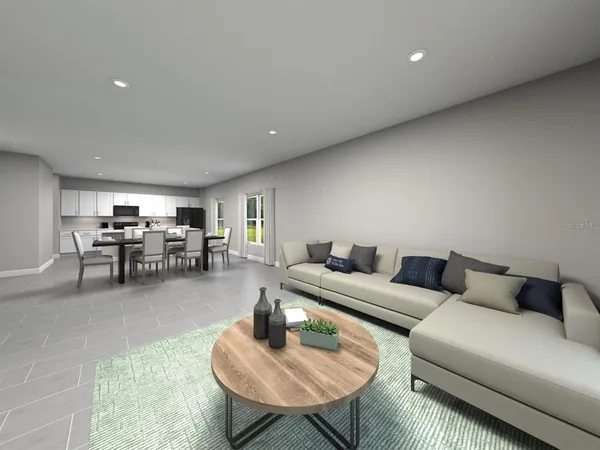 a living room with furniture and a table