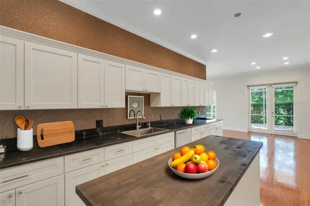 a kitchen that has a sink and a stove