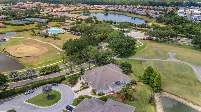 a view of a golf course with a lake view