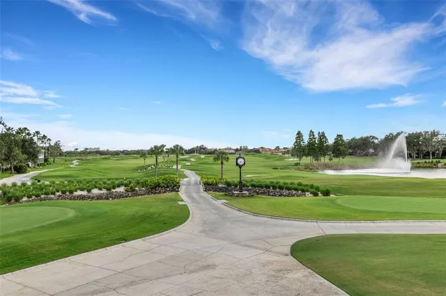 an aerial view of a house with a garden and swimming pool
