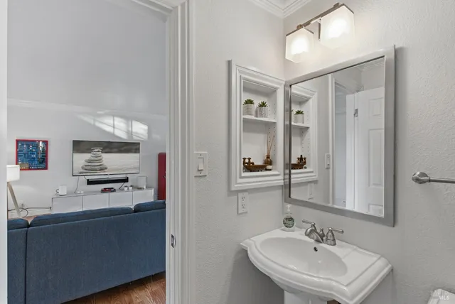 a en suite bathroom with a sink and mirror