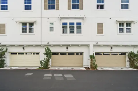 a front view of a building with a lot of garage
