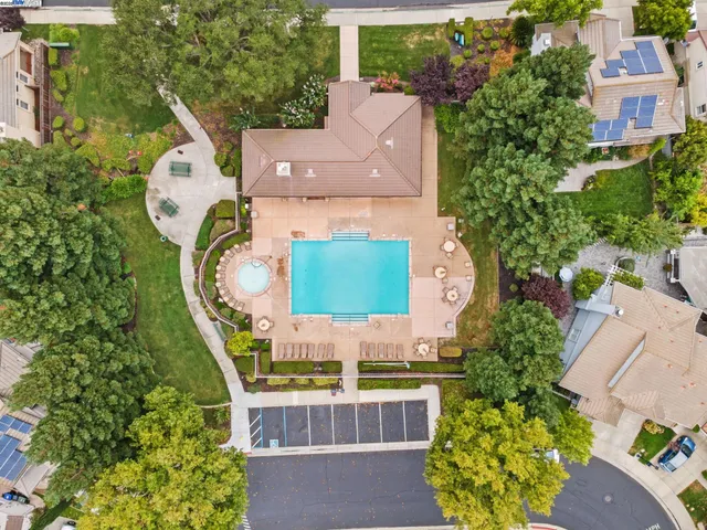 an aerial view of a house with garden space sitting space and swimming pool