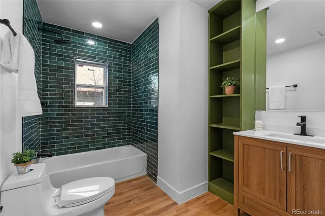 a bathroom with a toilet a sink and bathtub