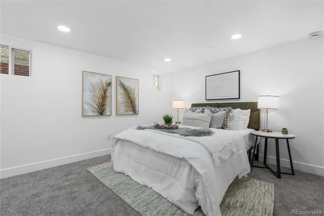 a bedroom with bed and night stand