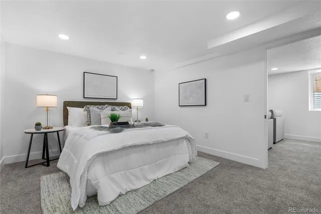 a bedroom with a bed and night stand