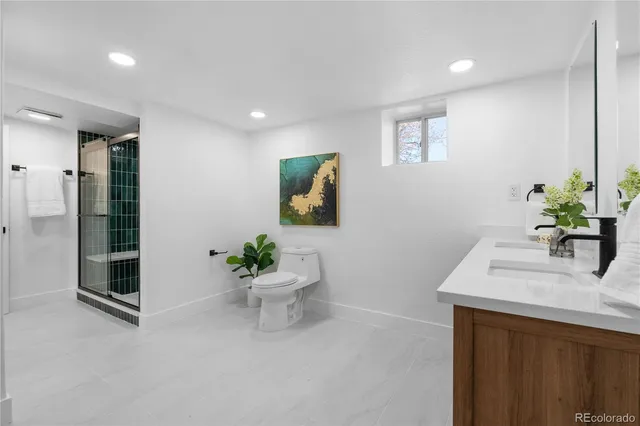 a room with a sink and a mirror