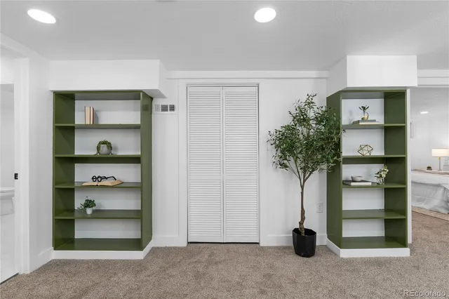 a room with furniture and a potted plant