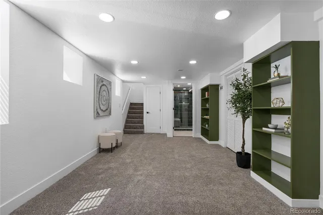 a view of an empty room with closet