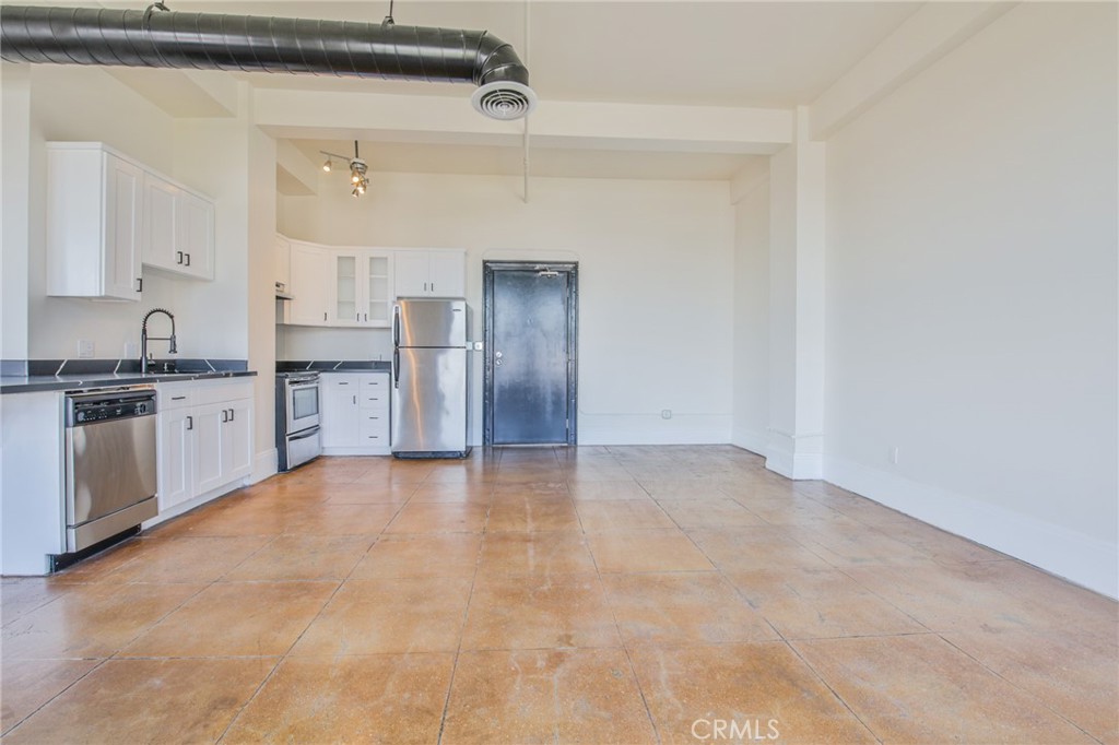 108 West 2nd Street, Unit 803 Los Angeles, CA 90012 - Photo 11 of 28 a view of a kitchen with a sink and cabinet