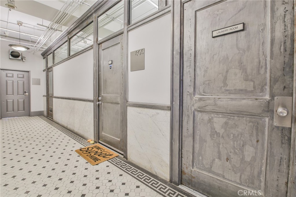 108 West 2nd Street, Unit 803 Los Angeles, CA 90012 - Photo 16 of 28 a bathroom with a shower and a sink