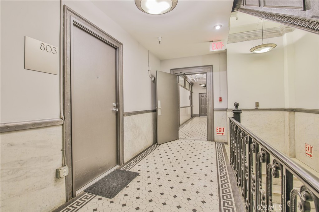 108 West 2nd Street, Unit 803 Los Angeles, CA 90012 - Photo 17 of 28 a view of a hallway with a chandelier
