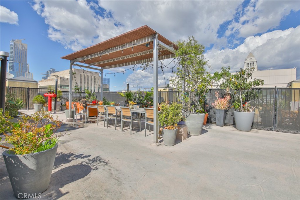 108 West 2nd Street, Unit 803 Los Angeles, CA 90012 - Photo 19 of 28 a view of a chair and tables in patio