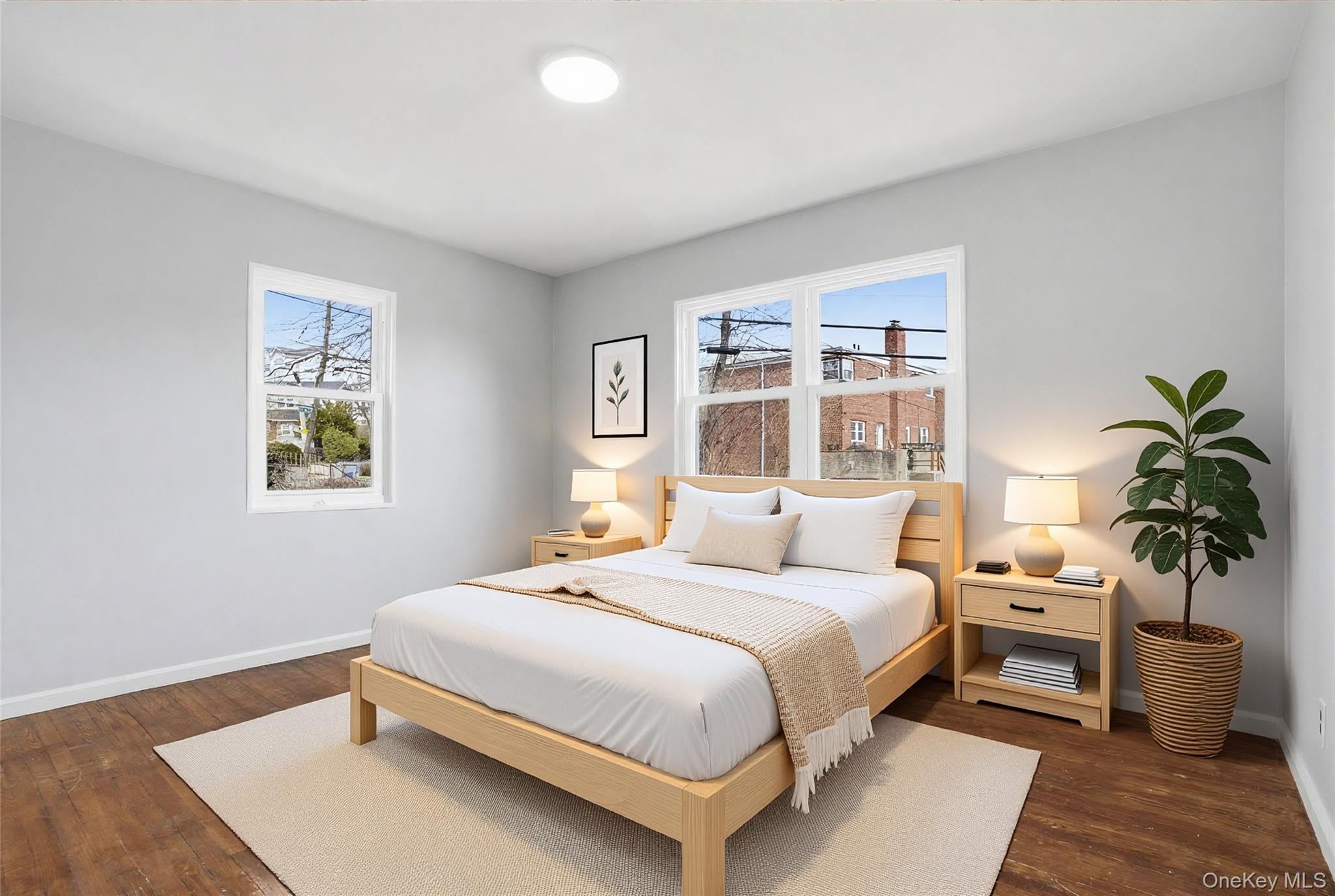 71 Glen Road Yonkers, NY 10704 - Photo 11 of 30 a bedroom with a large bed and a potted plant