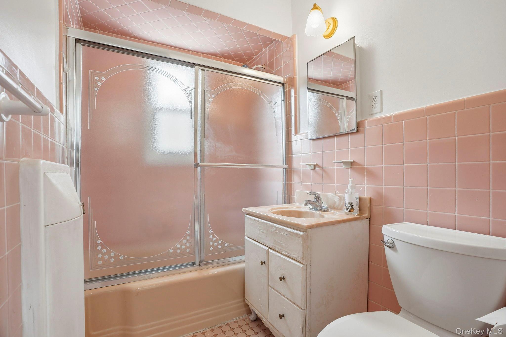 71 Glen Road Yonkers, NY 10704 - Photo 12 of 30 a bathroom with a sink toilet tub and shower