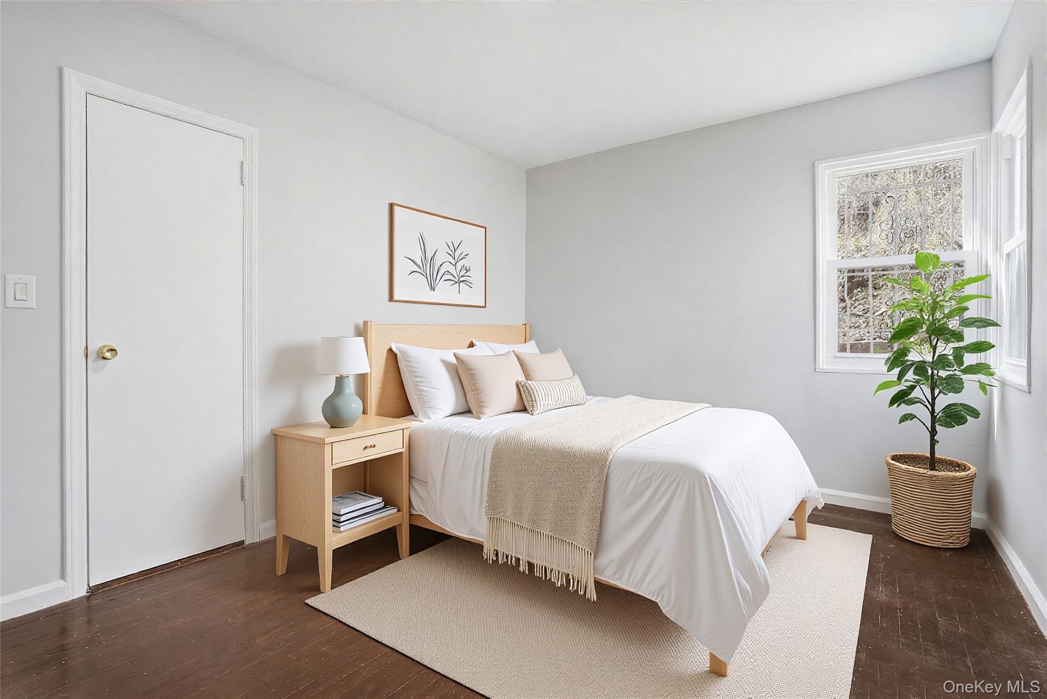 71 Glen Road Yonkers, NY 10704 - Photo 14 of 30 a bedroom with a bed and a potted plant