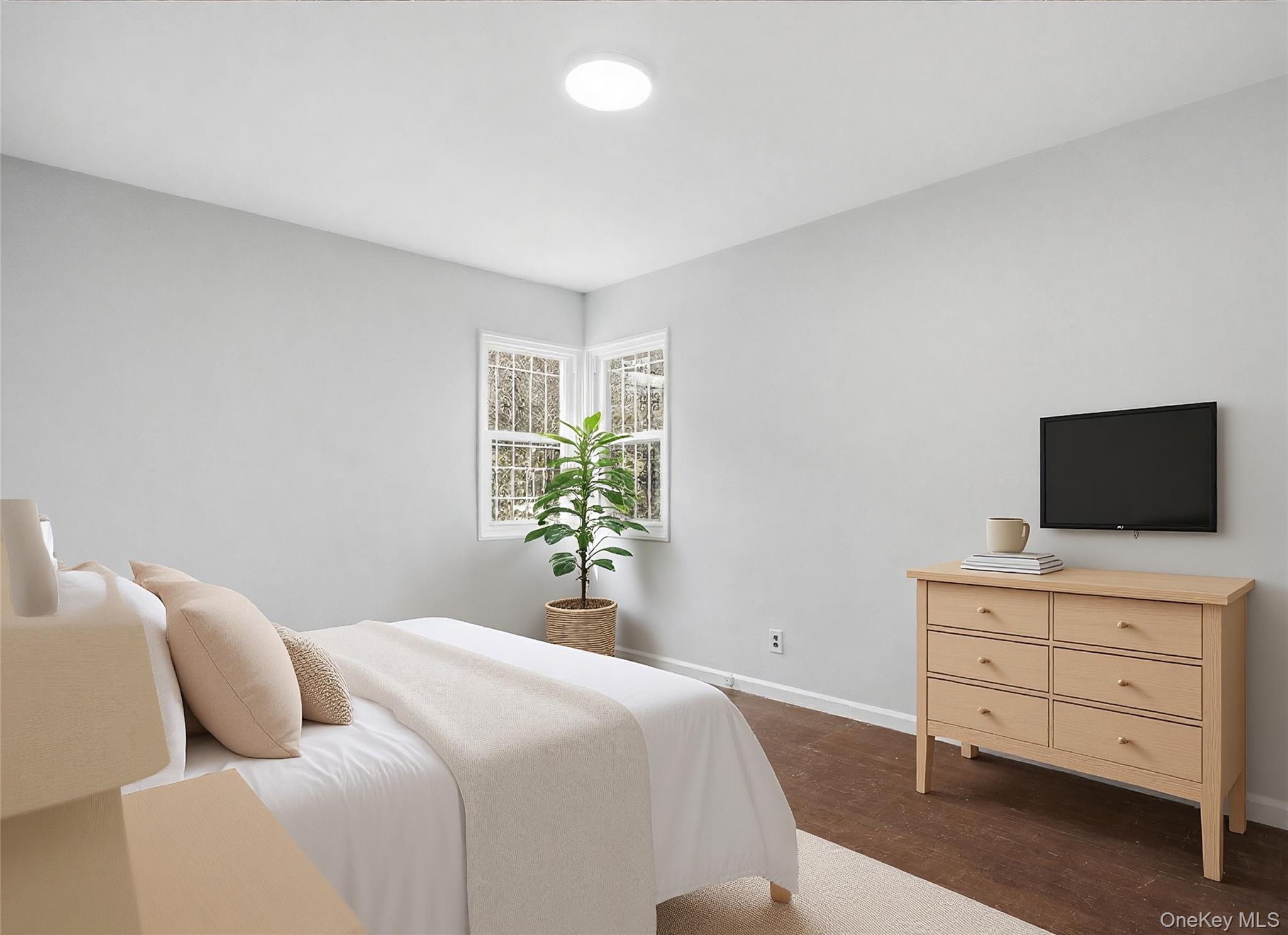 71 Glen Road Yonkers, NY 10704 - Photo 15 of 30 a bedroom with a bed and a flat screen tv