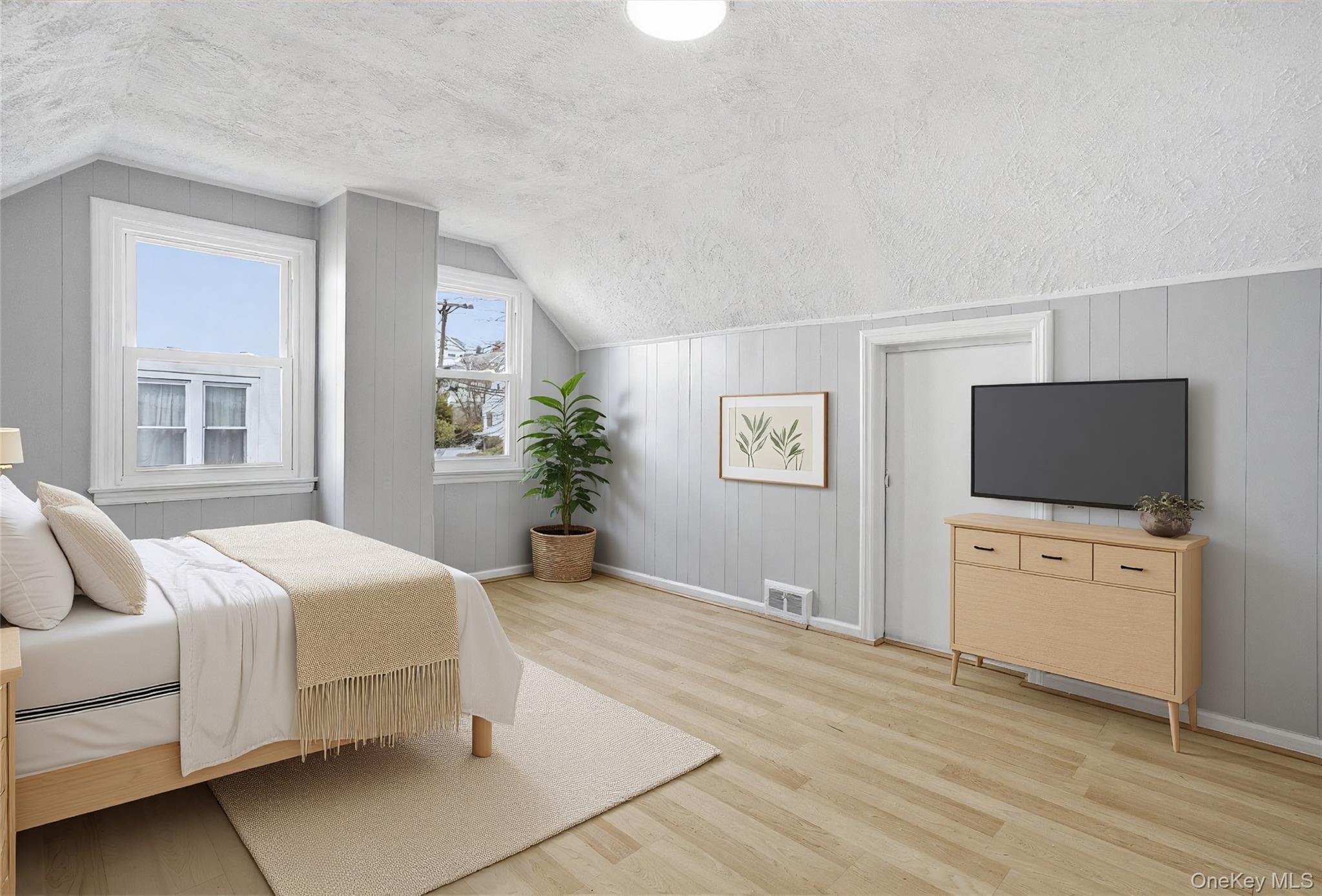 71 Glen Road Yonkers, NY 10704 - Photo 17 of 30 a bedroom with a bed and a flat screen tv