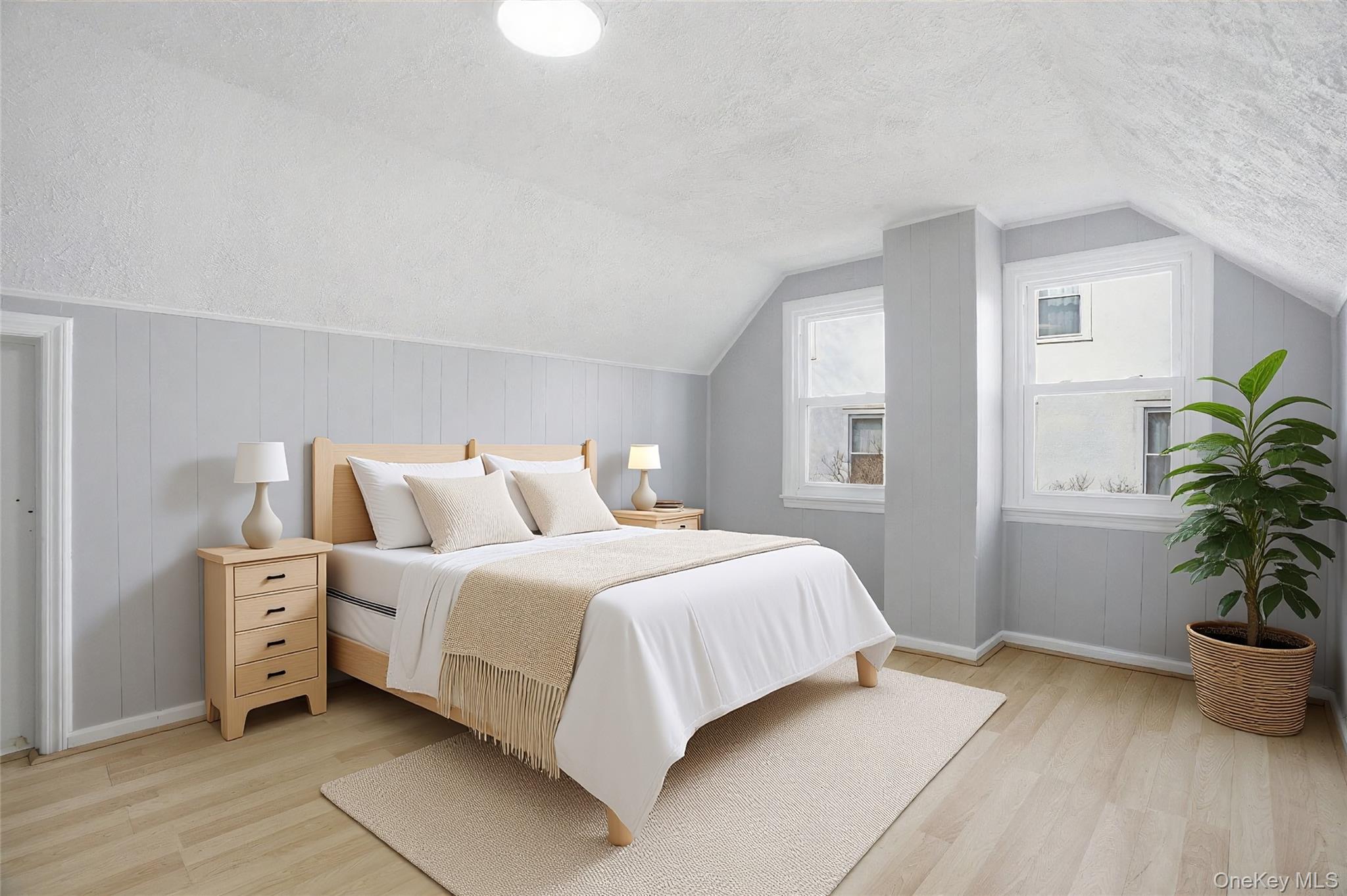71 Glen Road Yonkers, NY 10704 - Photo 19 of 30 a bedroom with a bed and a potted plant