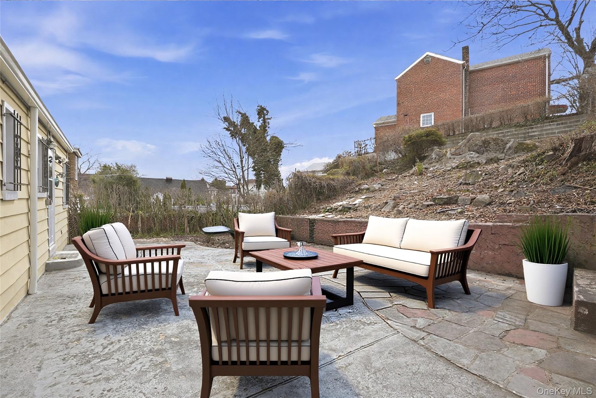 71 Glen Road Yonkers, NY 10704 - Photo 21 of 30 a roof deck with outdoor seating and city view