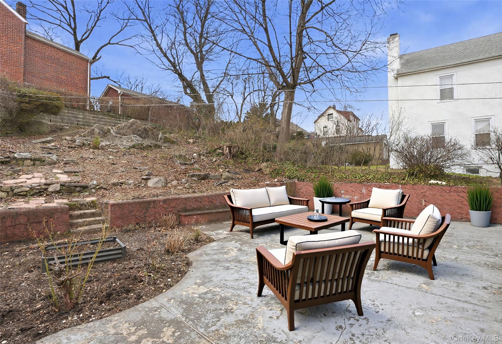 71 Glen Road Yonkers, NY 10704 - Photo 22 of 30 a view of a patio with fire pit