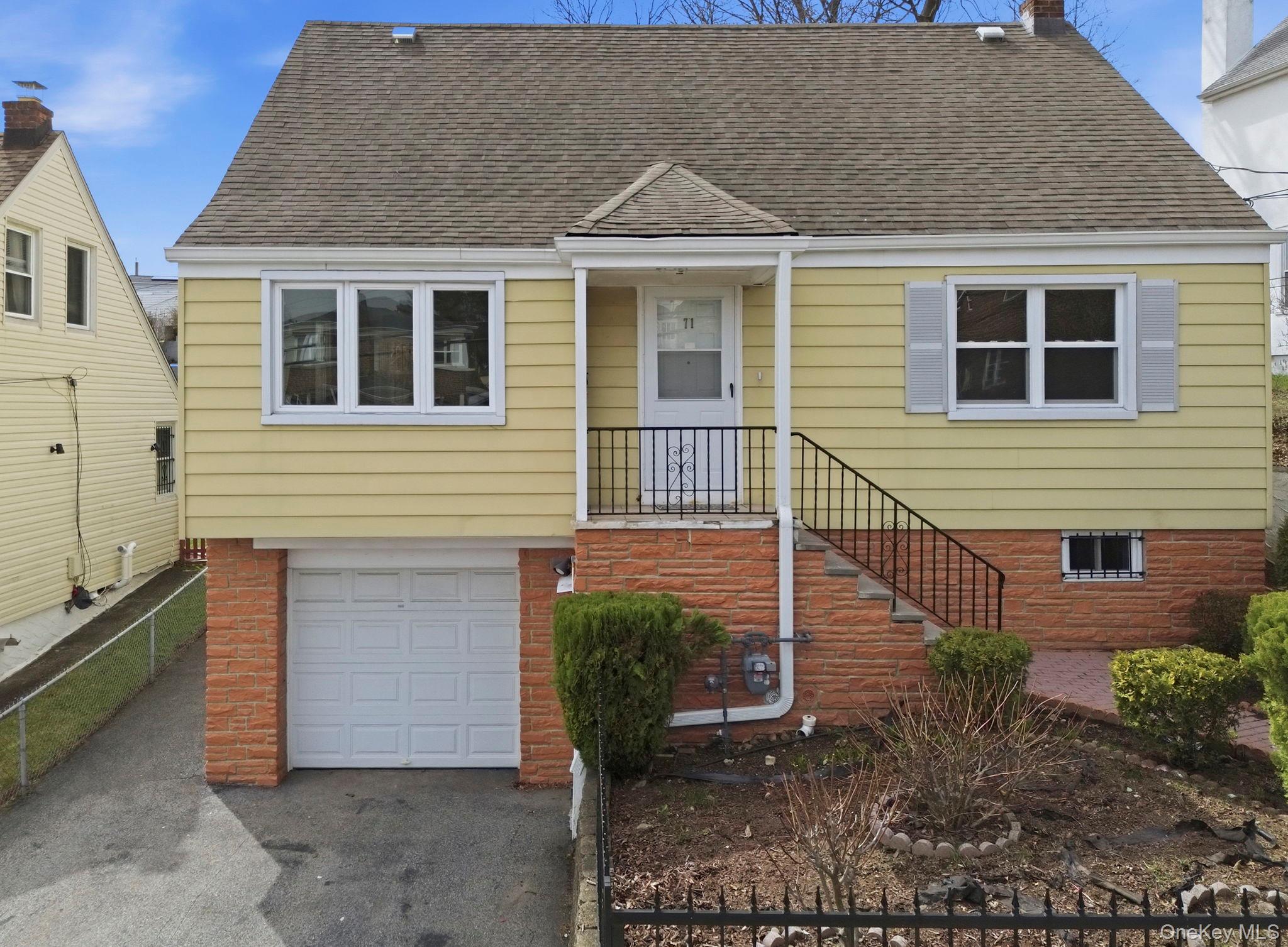 71 Glen Road Yonkers, NY 10704 - Photo 25 of 30 a front view of a house with garden