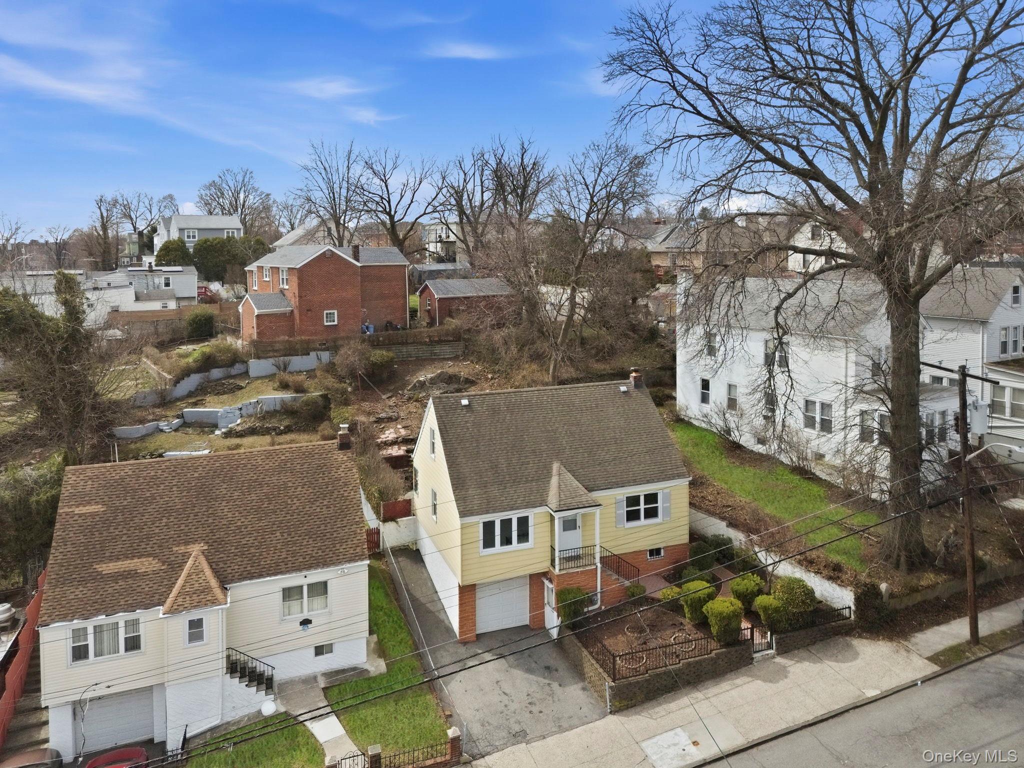 71 Glen Road Yonkers, NY 10704 - Photo 27 of 30 an aerial view of residential houses with outdoor space