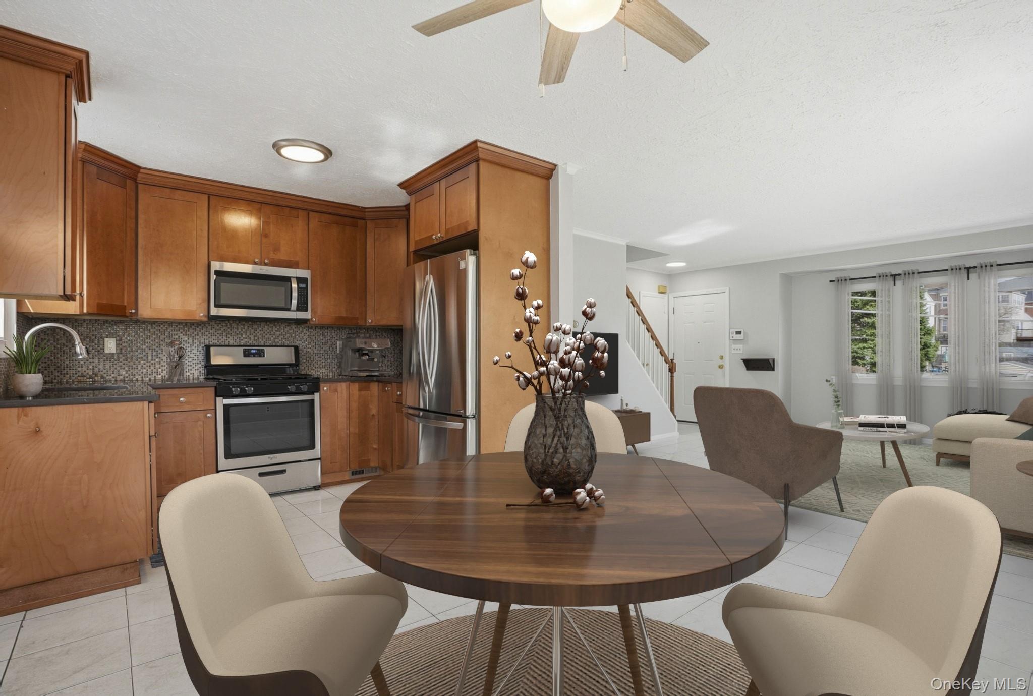 71 Glen Road Yonkers, NY 10704 - Photo 8 of 30 a dining room with furniture a window and kitchen view