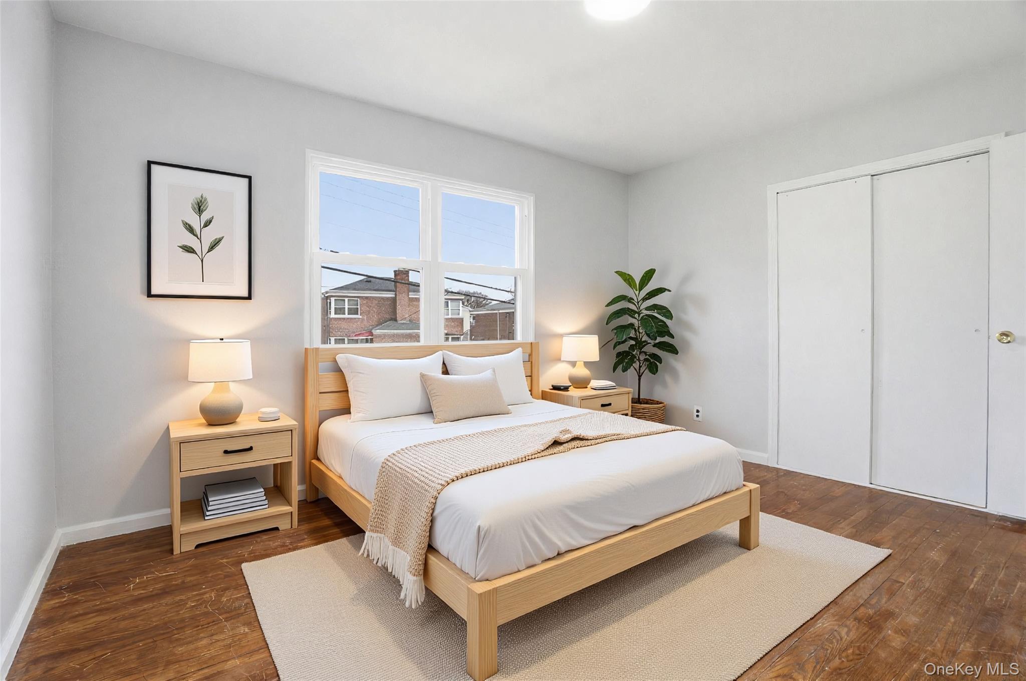 71 Glen Road Yonkers, NY 10704 - Photo 10 of 30 a bedroom with a bed and a potted plant