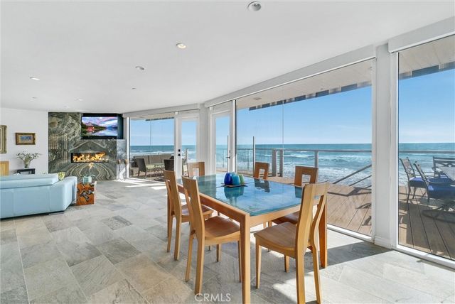 a bedroom with a bed couch and window