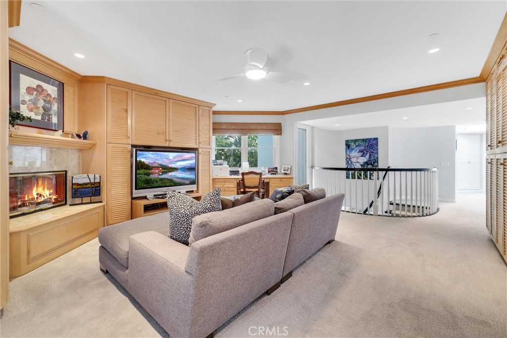35781 Beach Road Dana Point, CA 92624 - Photo 25 of 58 a living room with furniture and a fireplace