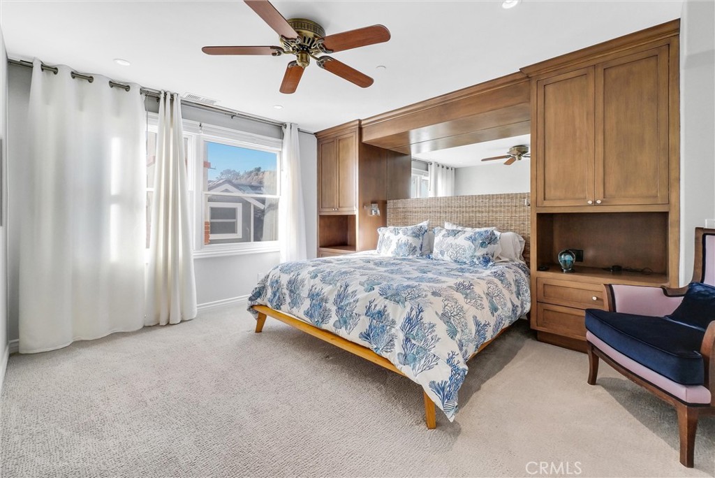 35781 Beach Road Dana Point, CA 92624 - Photo 30 of 58 a bedroom with a bed couch and window