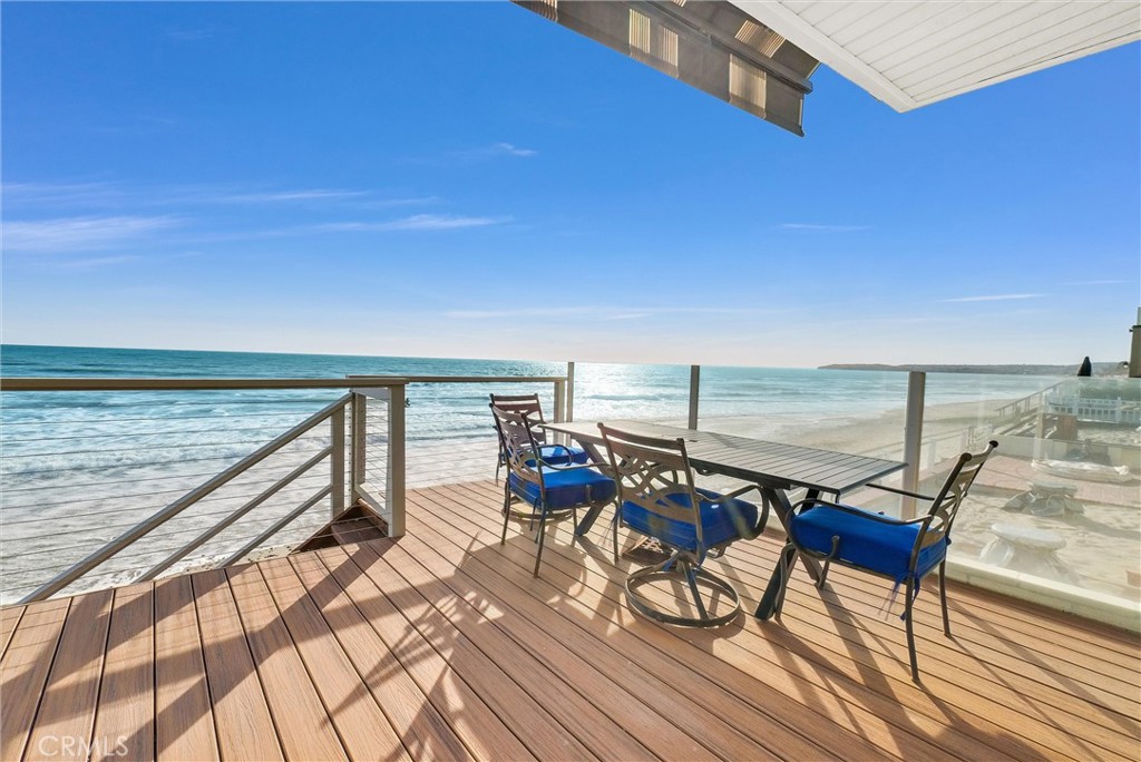 35781 Beach Road Dana Point, CA 92624 - Photo 45 of 58 a view of a balcony with chairs and wooden floor