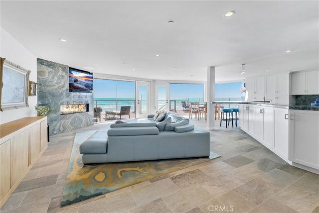 a bathroom with a granite countertop sink a toilet and a shower