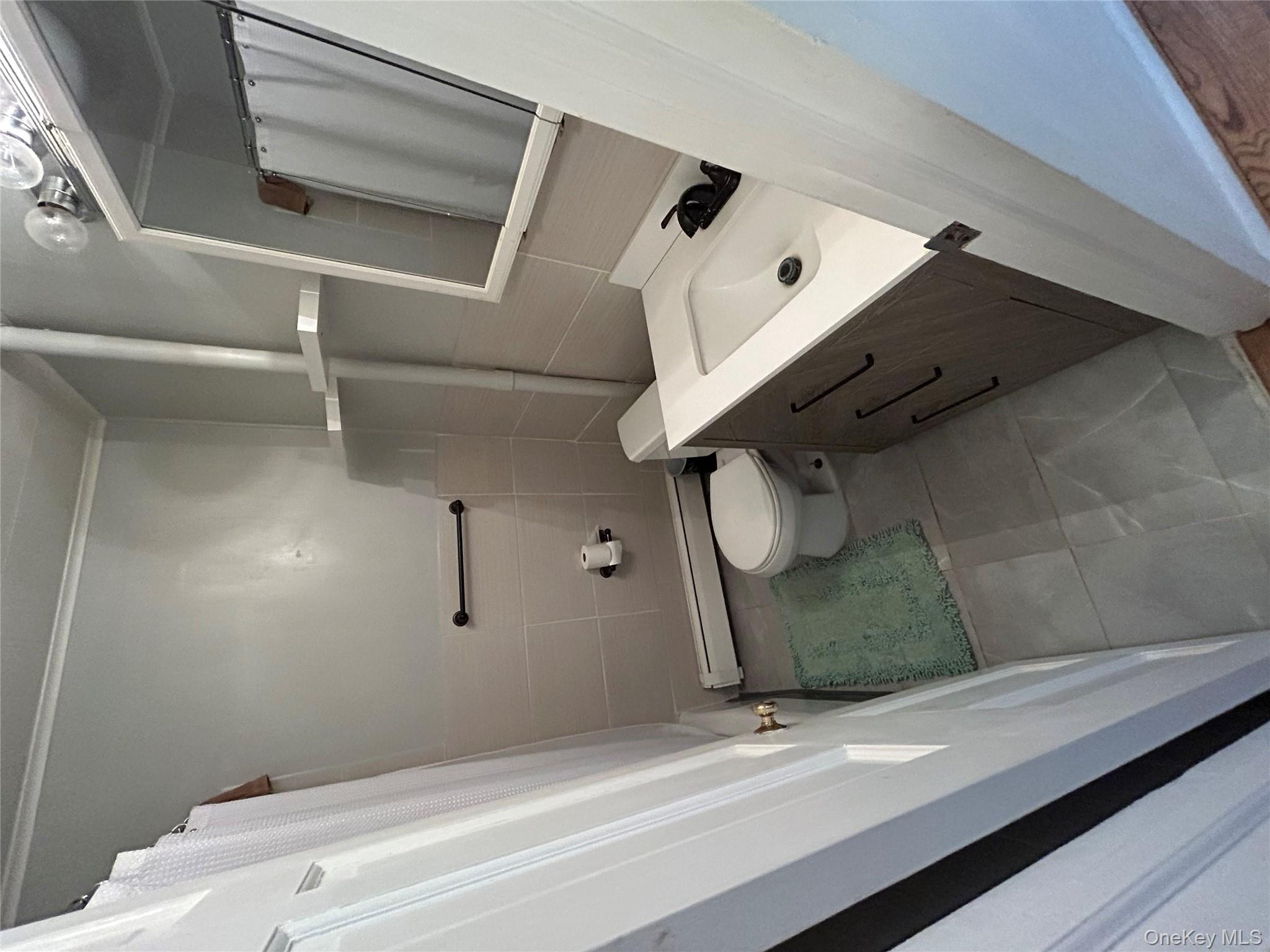 16 Joseph Road Holmes, NY 12531 - Photo 10 of 21 a bathroom with a sink a toilet and shower