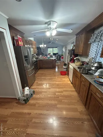 a living room with furniture a window and a table