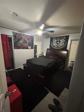 a living room with a rug and a couch