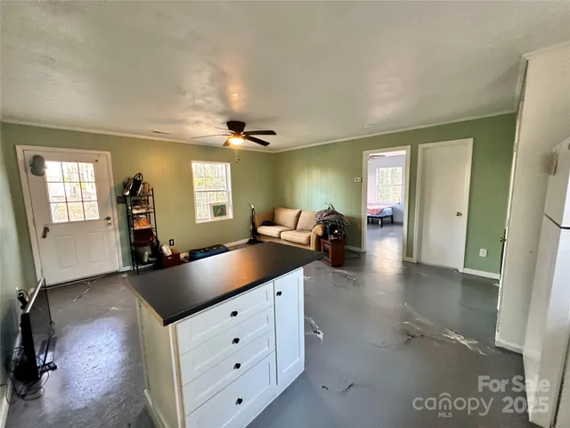 a kitchen with sink and mirror