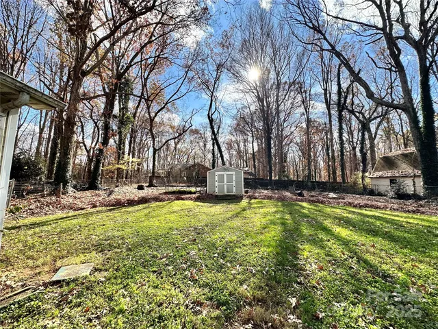 a view of a swimming pool with a house