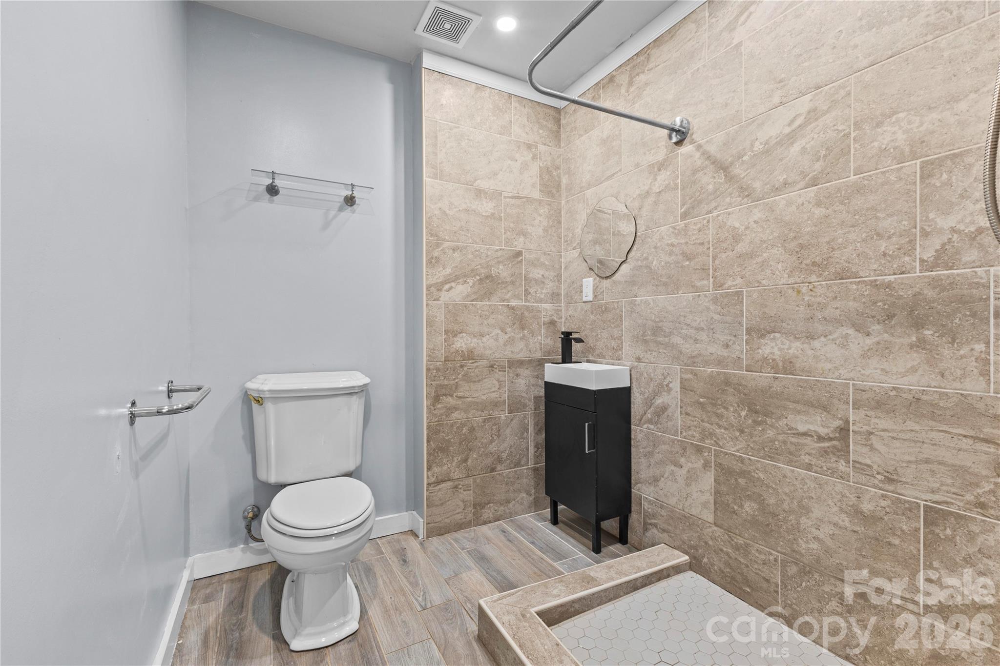 117 Robinson Avenue Matthews, NC 28104 - Photo 25 of 42 a bathroom with a toilet and a shower