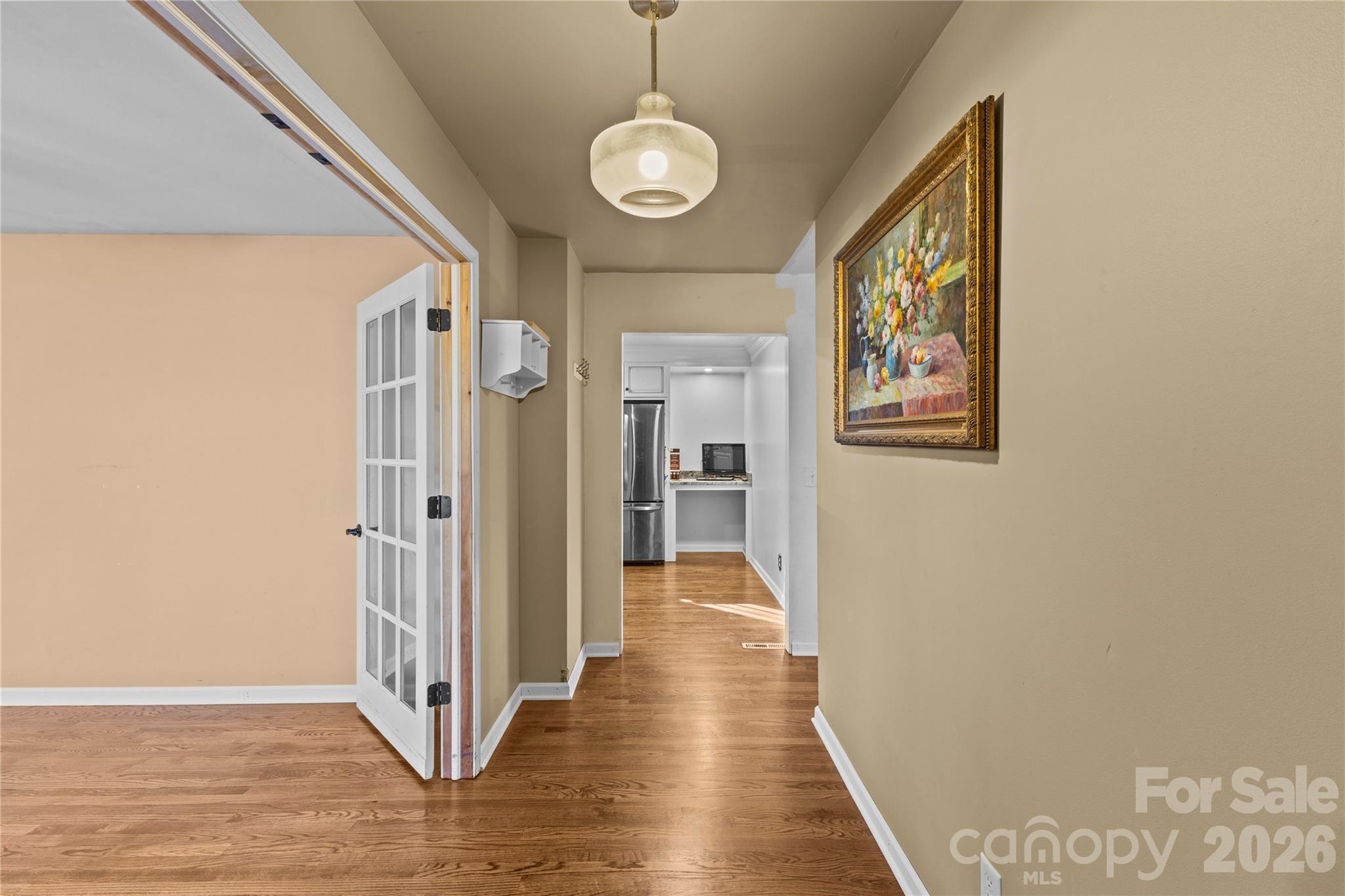 117 Robinson Avenue Matthews, NC 28104 - Photo 4 of 42 a view of a hallway with wooden floor and staircase