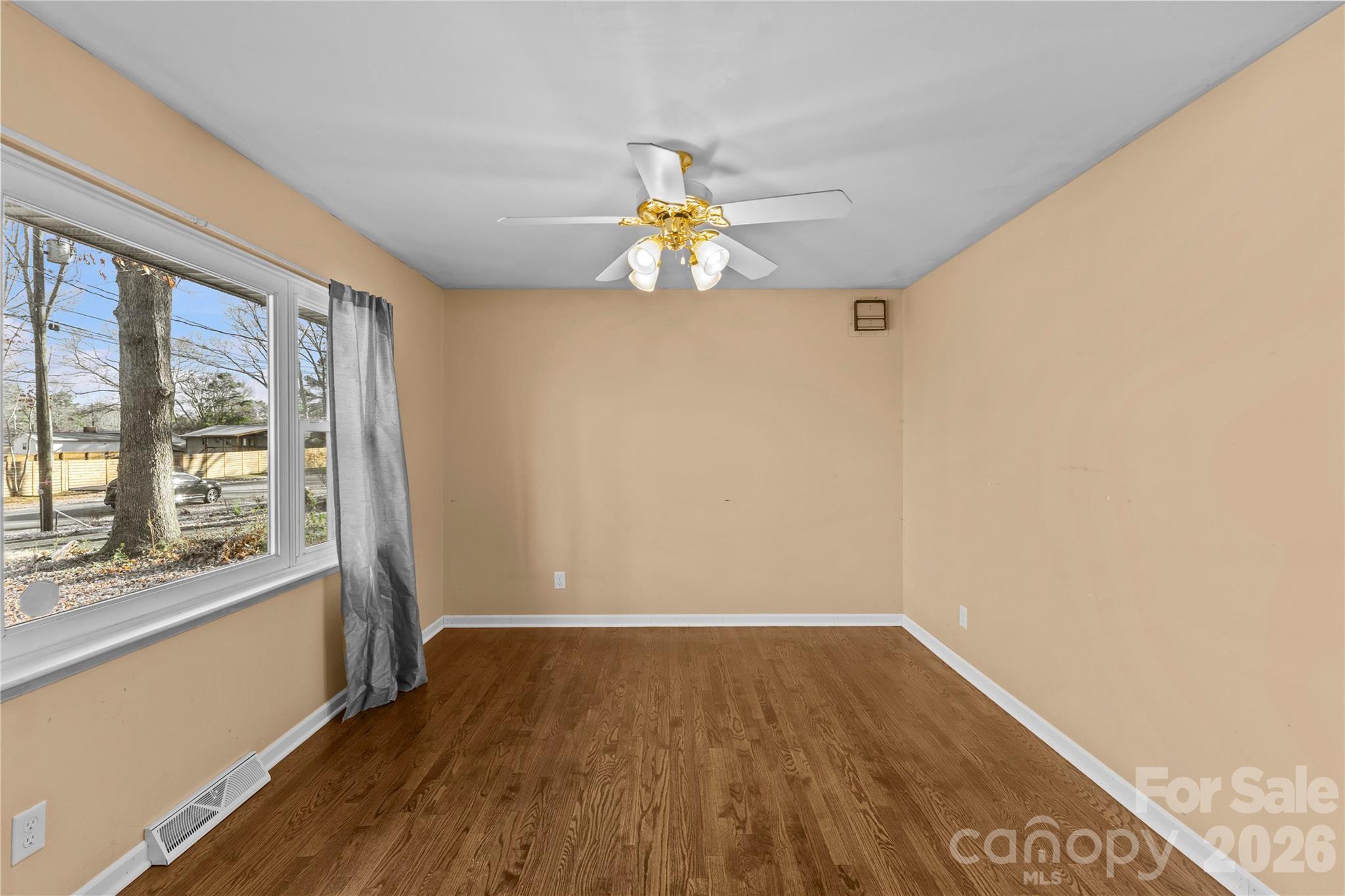 117 Robinson Avenue Matthews, NC 28104 - Photo 6 of 42 a very nice looking room with wooden floor and a window