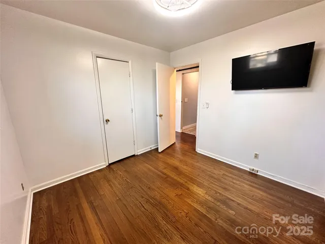 a view of a livingroom with wooden floor