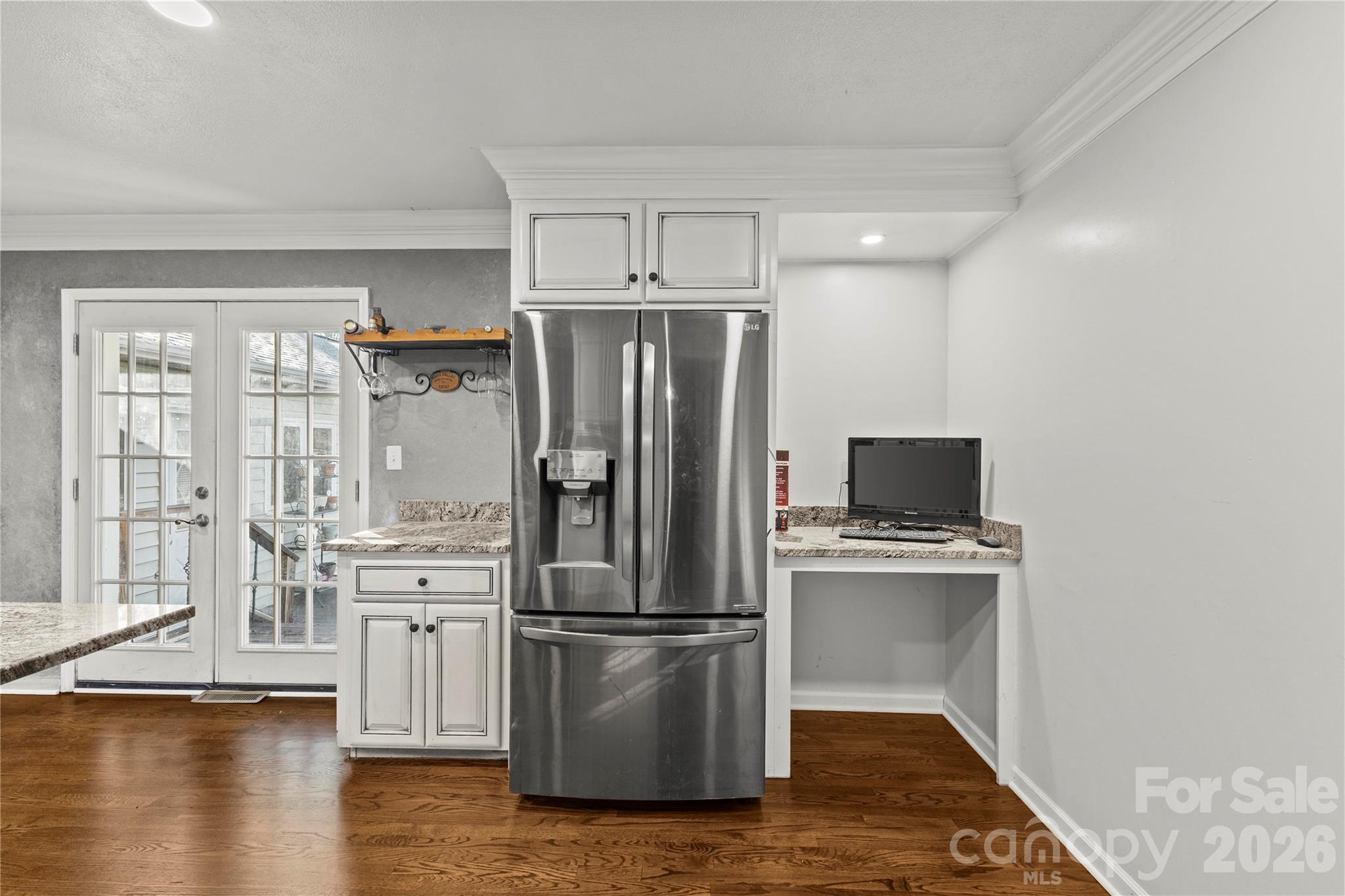 117 Robinson Avenue Matthews, NC 28104 - Photo 7 of 42 a kitchen with stainless steel appliances a refrigerator stove and sink