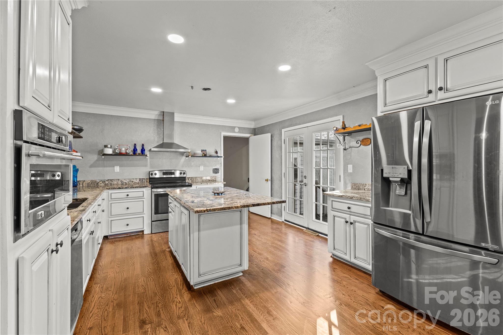 117 Robinson Avenue Matthews, NC 28104 - Photo 8 of 42 a kitchen with stainless steel appliances a refrigerator sink and microwave