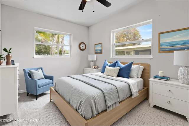 a bedroom with bed and window