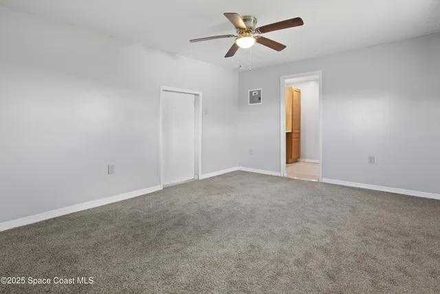 a view of a big room with carpet