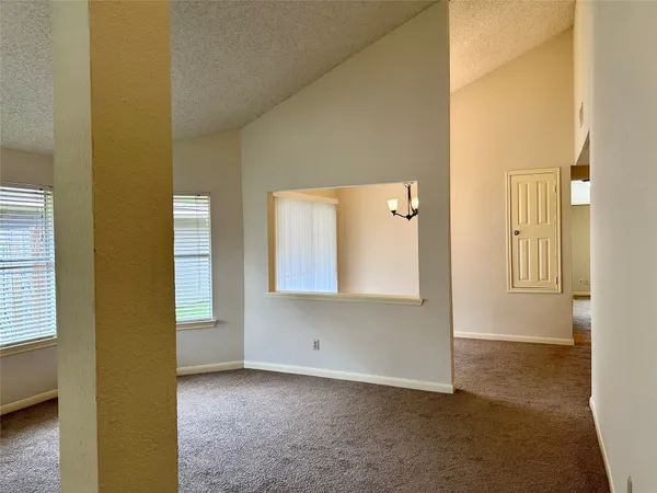 a view of an empty room and window