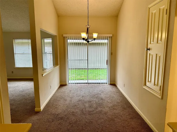 a view of a hallway with windows